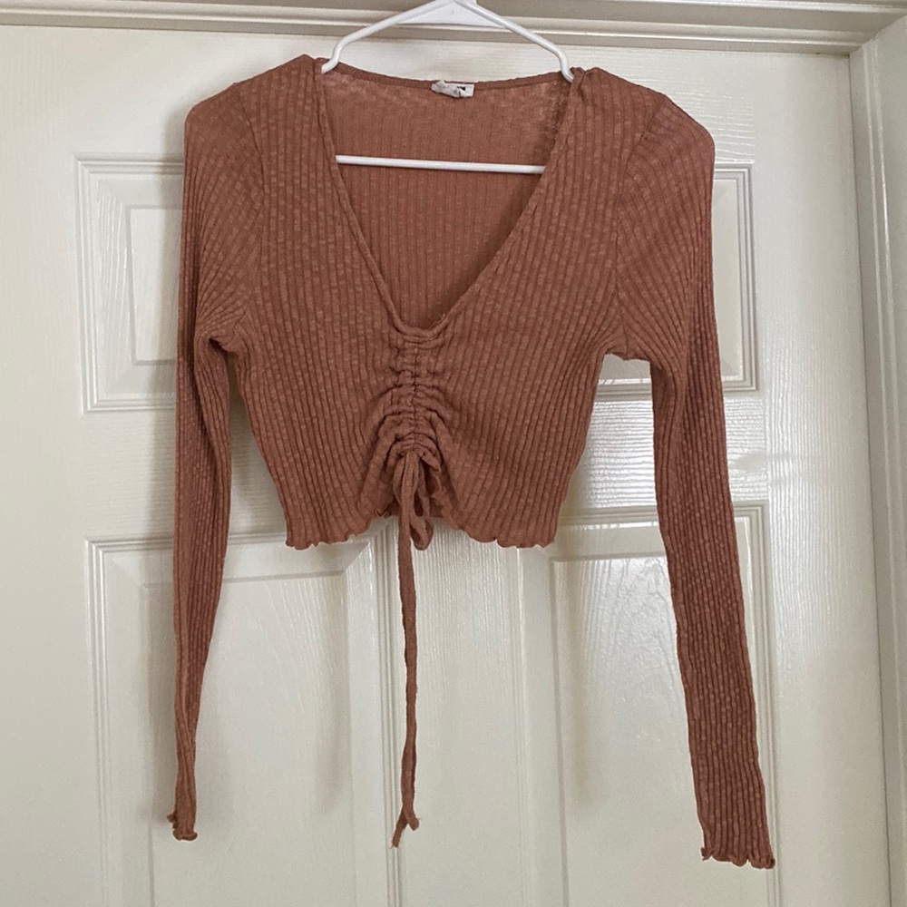 Cotton:On brand. long sleeve mauve colored crop top . adjustable string. SMALL